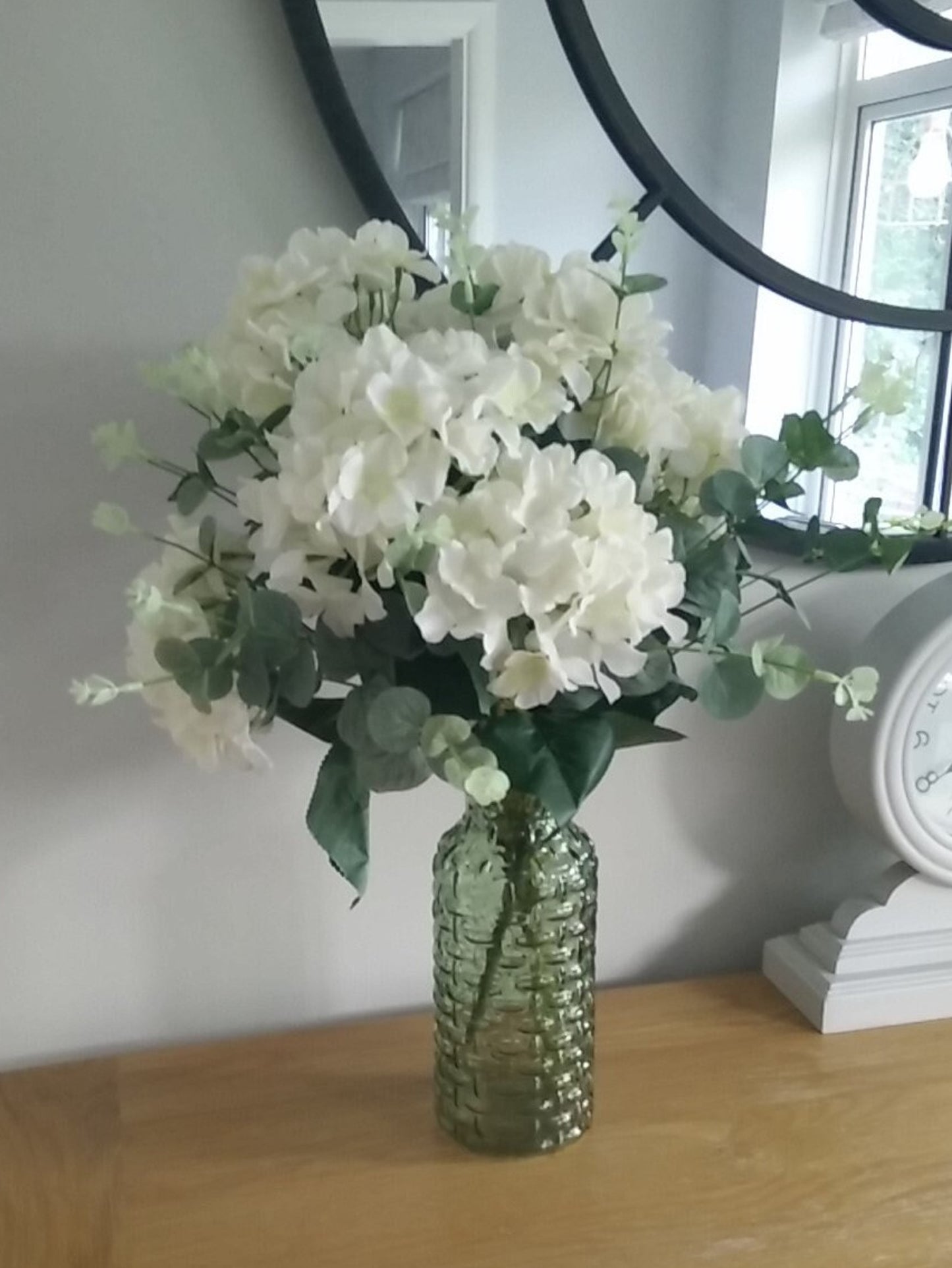 Hydrangea and Eucalyptus Silk Flower Arrangement With A Green Glass Vase